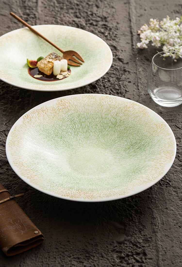 Fine dining deep bowl with gently curved rim and textured base
