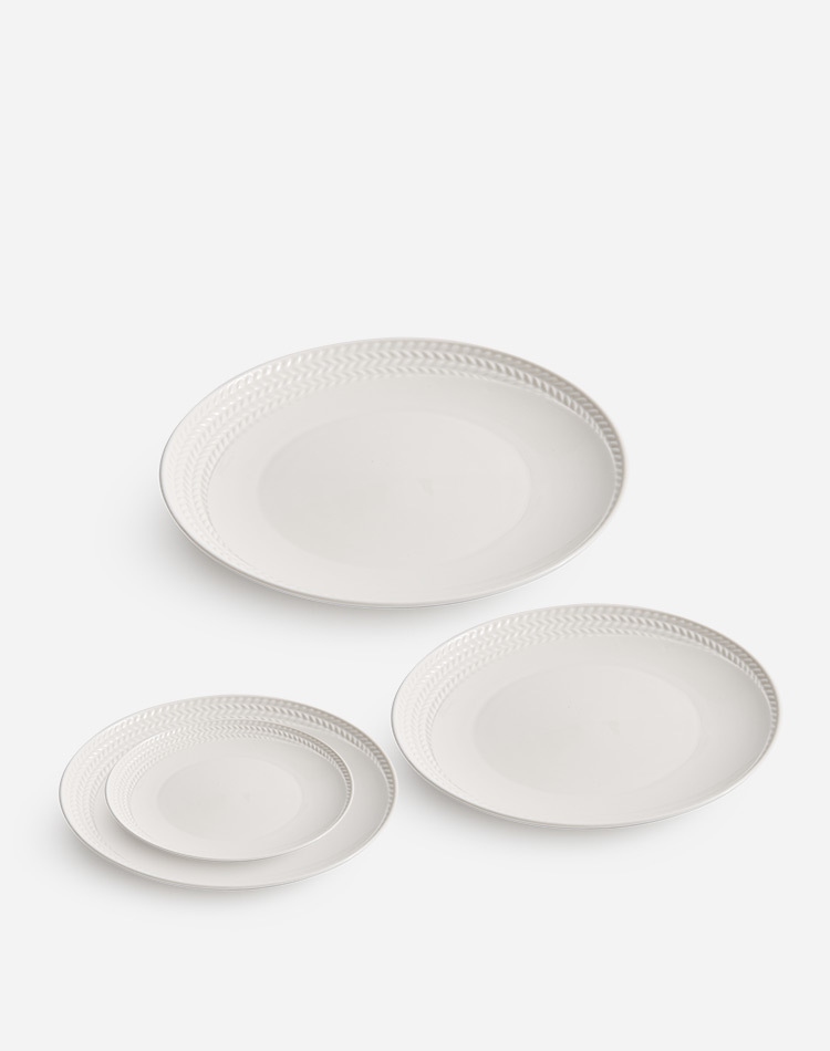 Timeless white porcelain tableware with embossed rim detail