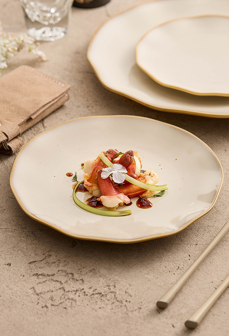 Top-down view of three different sized wavy-edge plates reflecting a serene, ripple-like visual harmony.