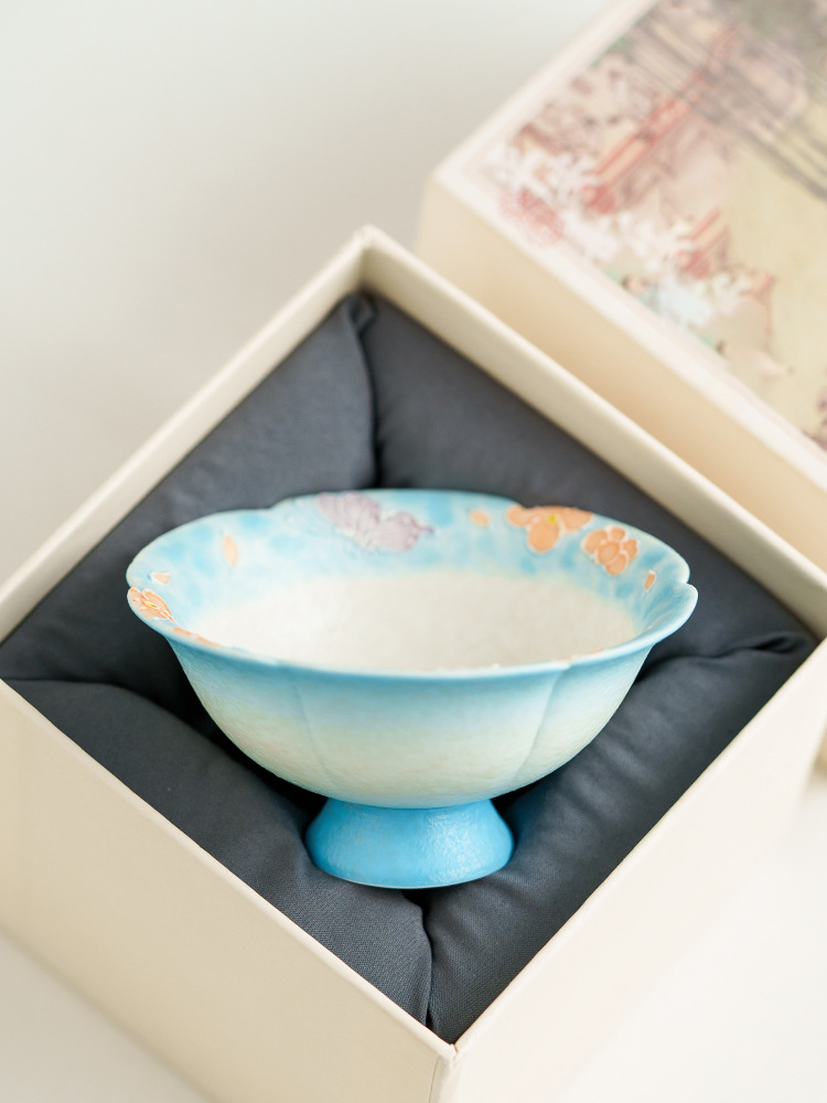 Traditional-style ceramic tea cup with flared rim