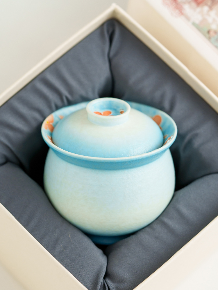 Traditional-style covered tea bowl with cultural design