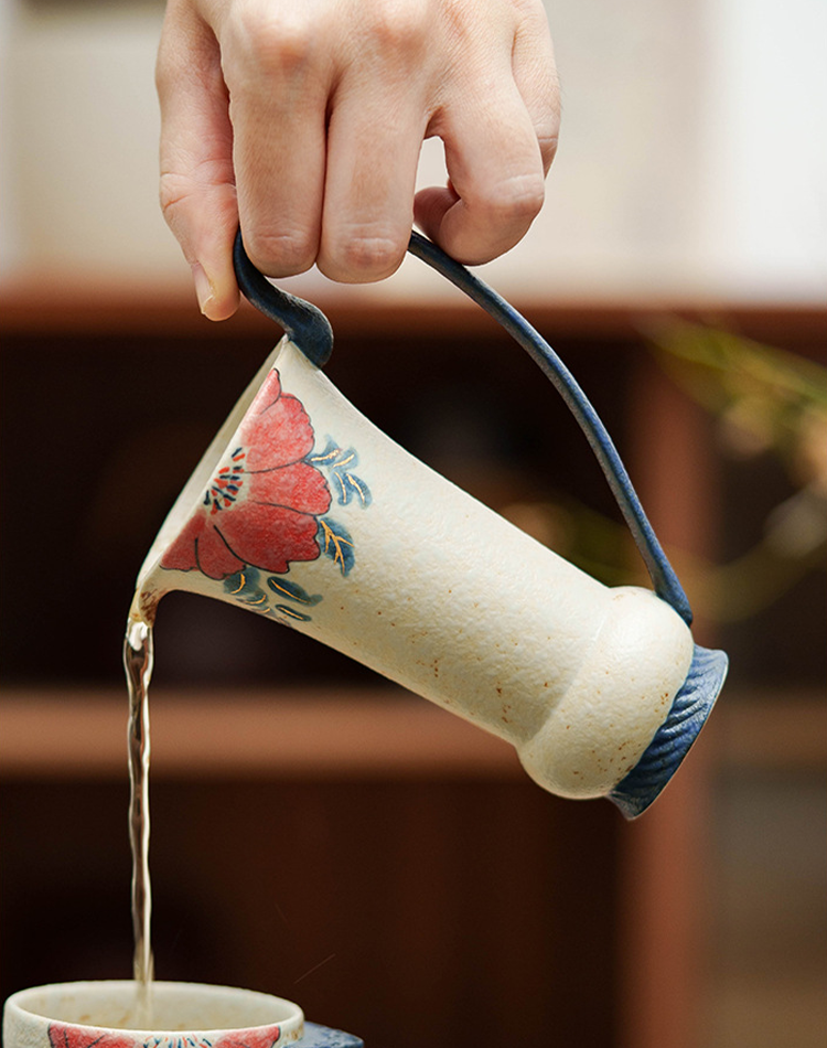 Vintage-style ceramic pouring jug with floral motif
