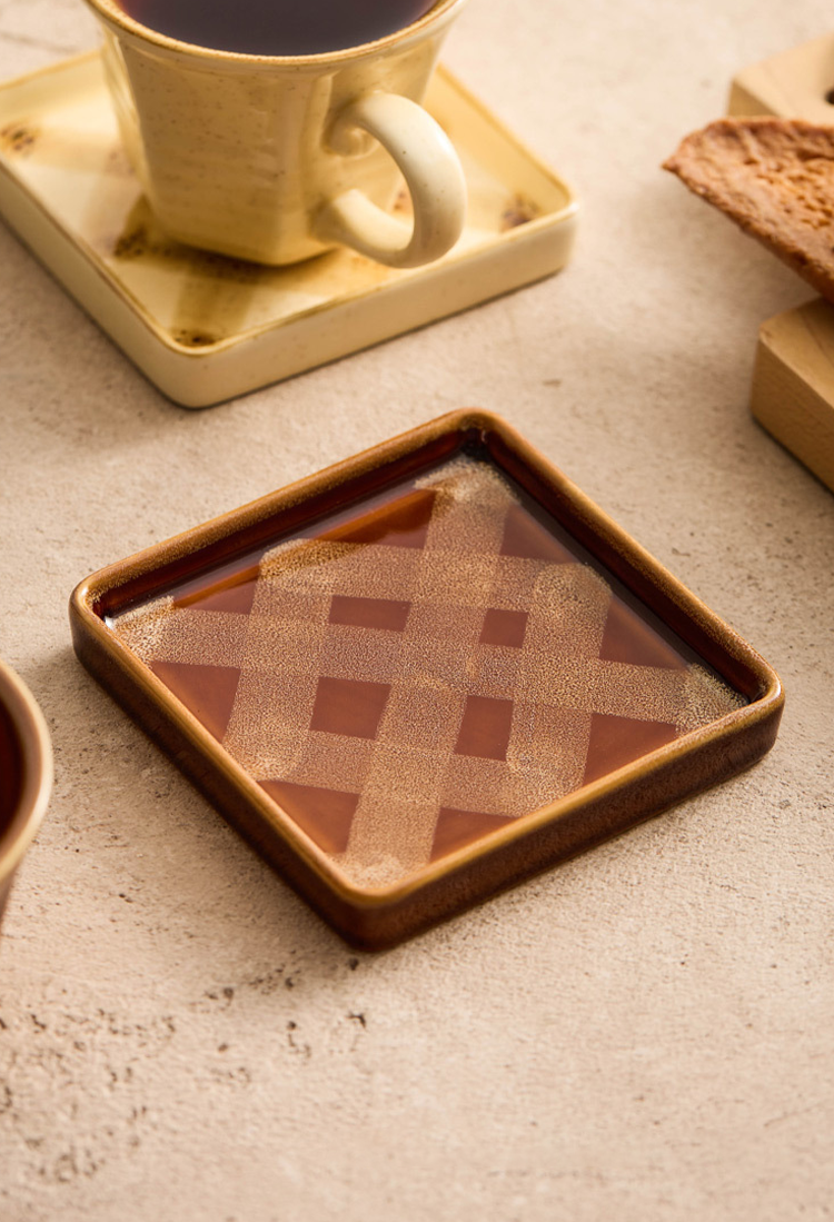 Vintage ceramic cappuccino cup on square saucer