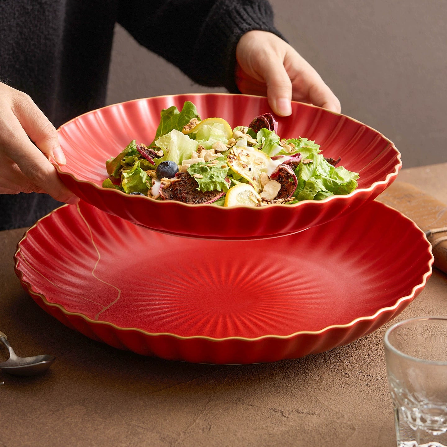 Wave-edged red ceramic bowl for modern dining table