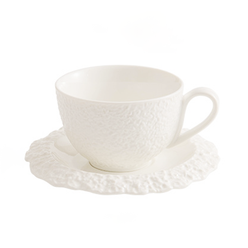 White ceramic cup and saucer for coffee or tea presentation
