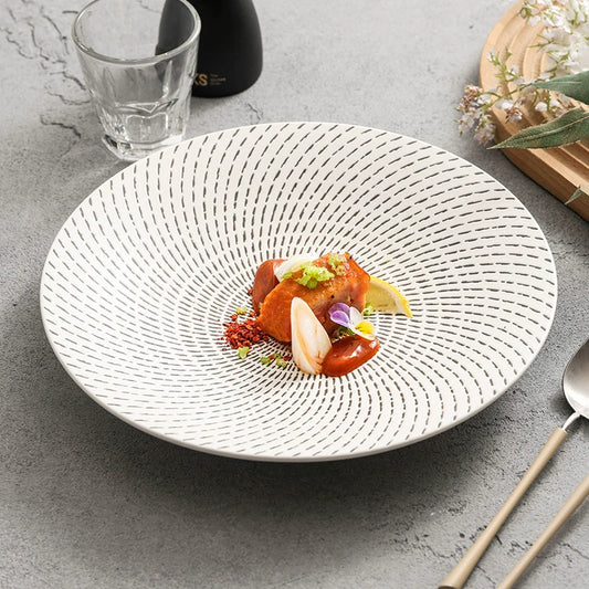 White ceramic dinner plate with meteor shower pattern


