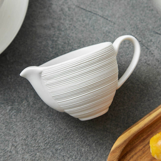 White ceramic milk jug with fine line texture

