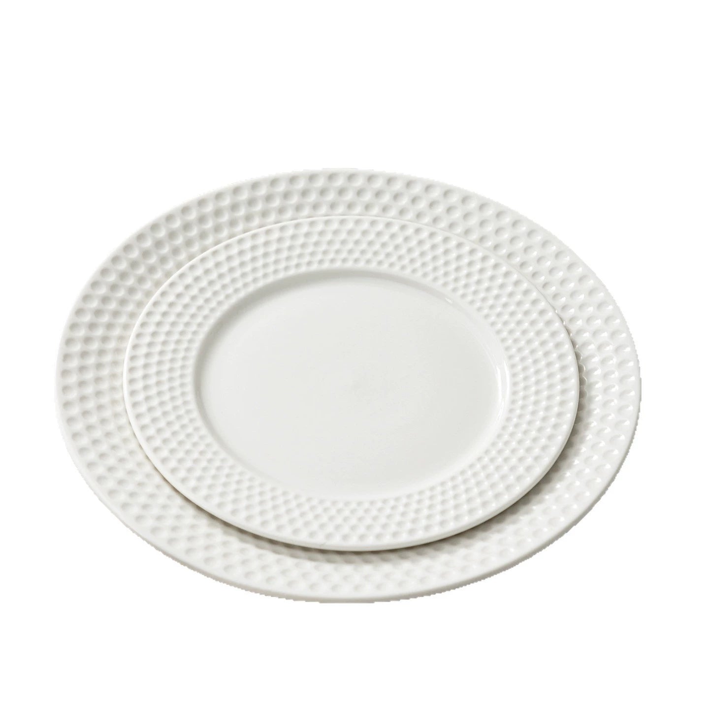 White dinner plate styled with gourmet seafood dish