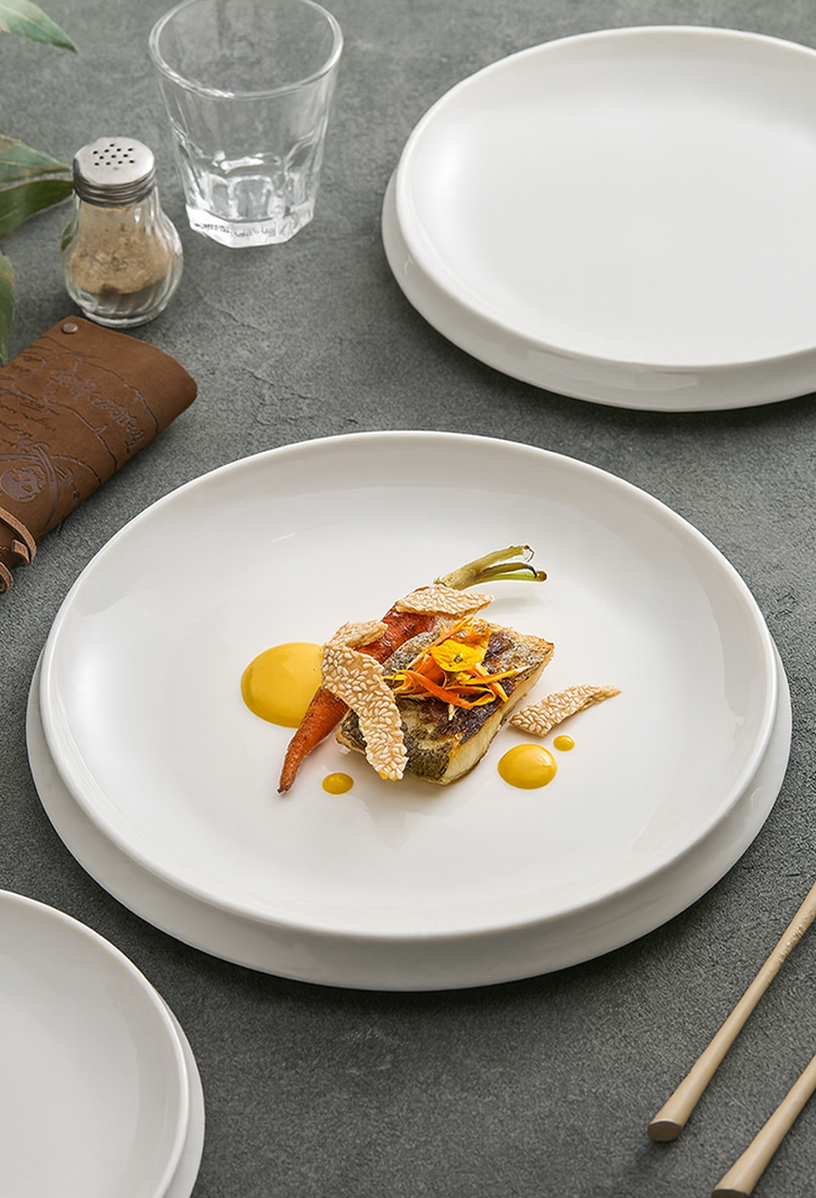 White porcelain deep plate with smooth curved edges