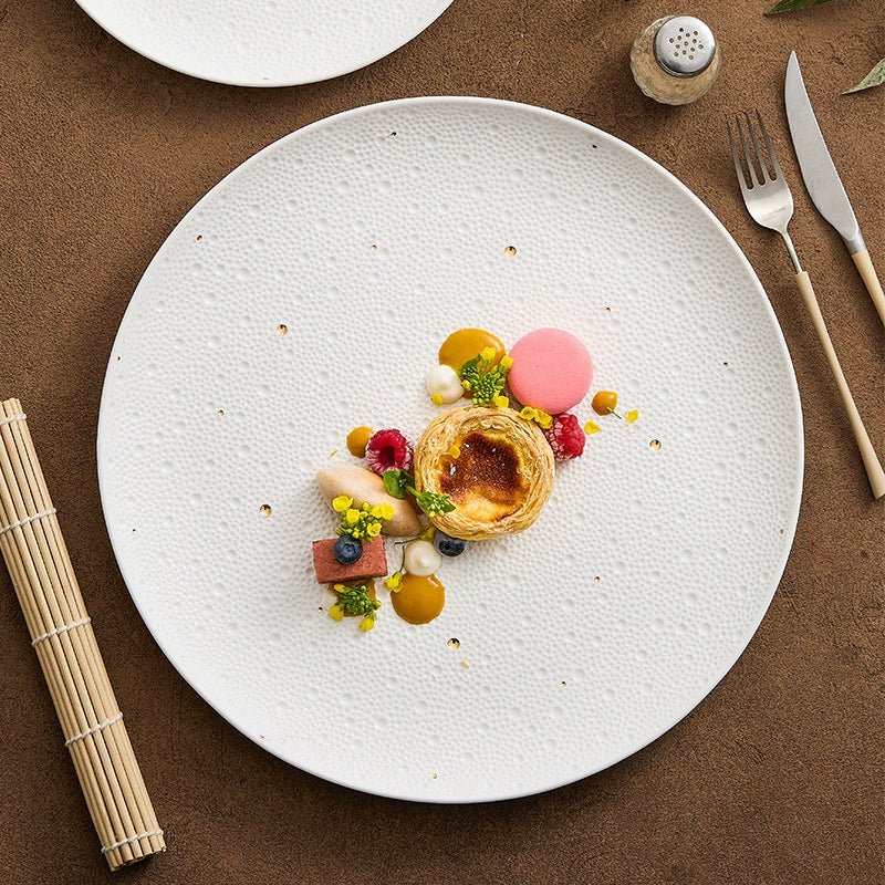 White porcelain dinner plate with gold speckled design