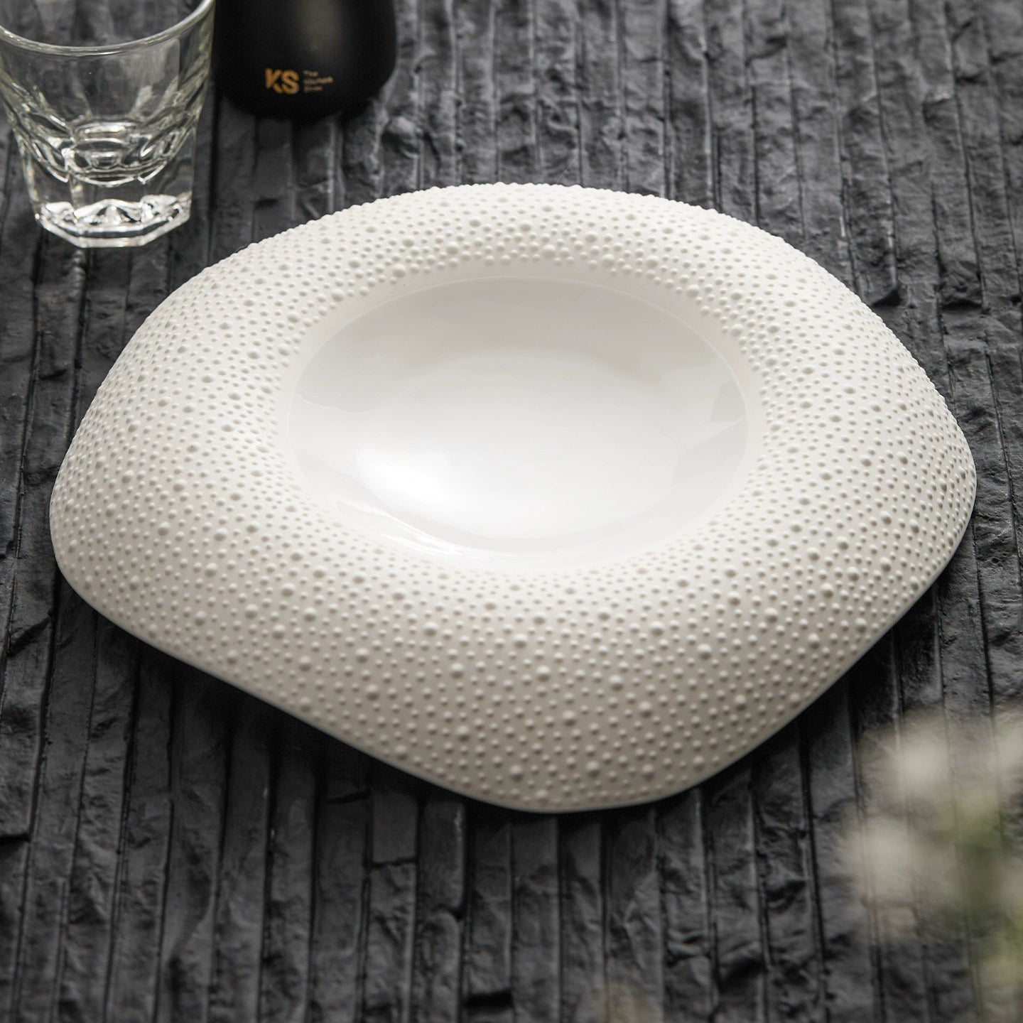 White textured porcelain dinner plate with organic shape