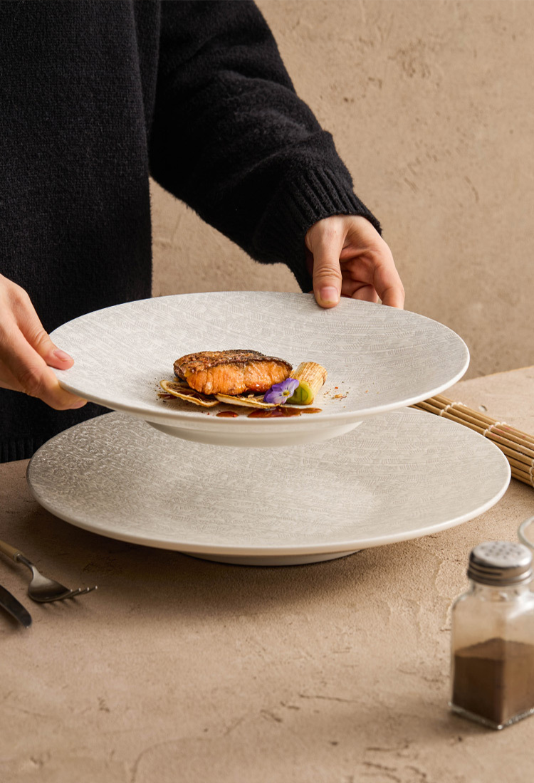 Wide shallow ceramic plate for elegant modern food plating