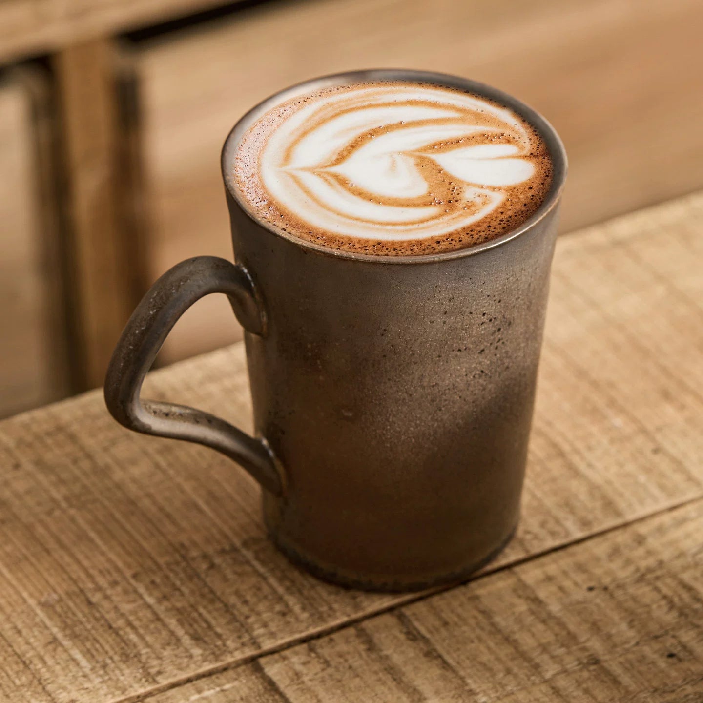 aesthetic morning coffee setup with three dark ceramic stoneware mugs