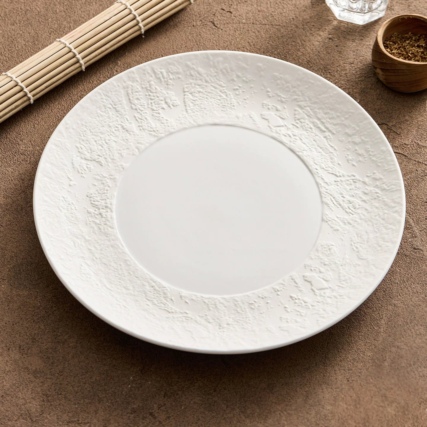 artisanal matte white dinnerware plate with micro sculpted organic rim