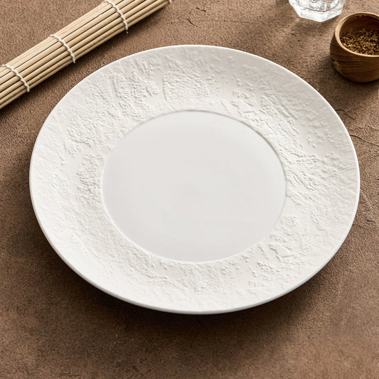 artisanal matte white dinnerware plate with micro sculpted organic rim