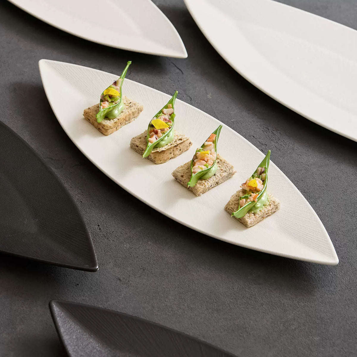 artisanal radial line textured long ceramic platter in white and black