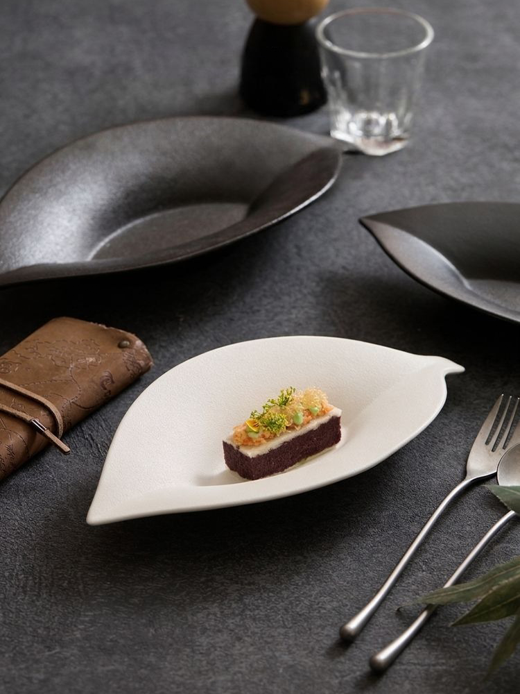 artisanal tactile matte stoneware dish in off white and black