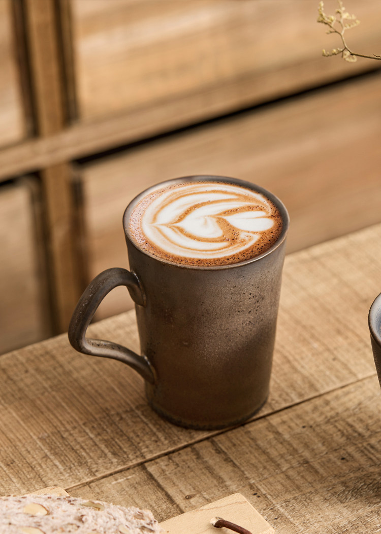 close up view of unique reactive glaze texture on artisanal stoneware mug