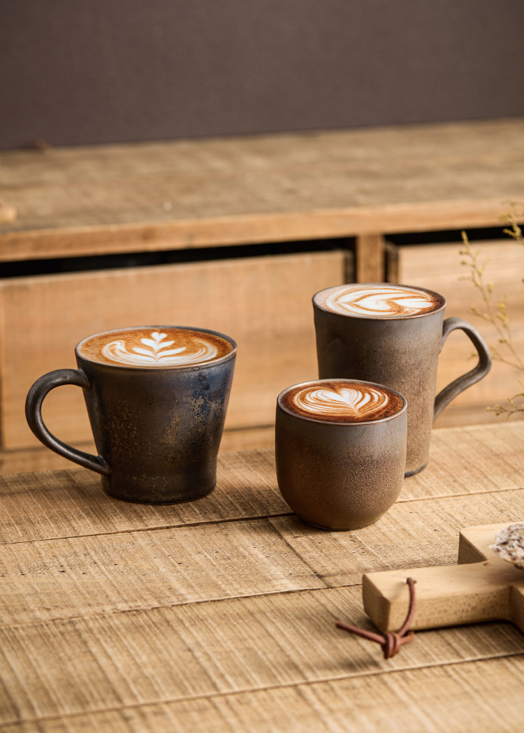 dark metallic matte finish artisanal coffee cup with hand textured surface