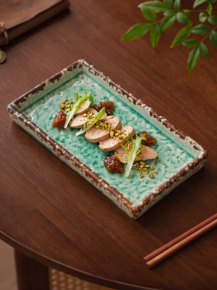 goseung emerald glaze dish with gourmet food styling