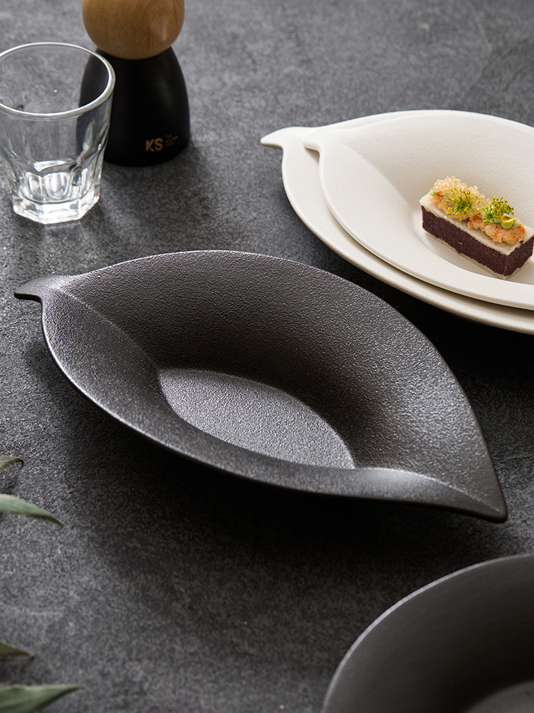 goseung leaf ceramic plate with delicate dessert on dark stone