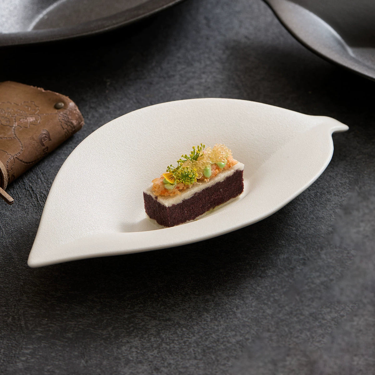 goseung leaf silhouette ceramic dish with gourmet appetizer presentation