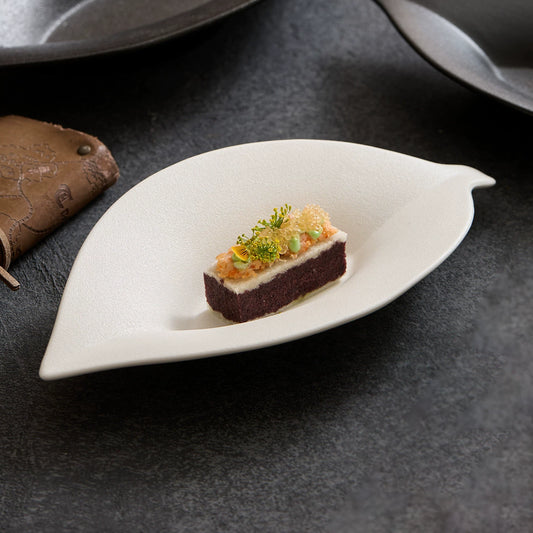 goseung leaf silhouette ceramic dish with gourmet appetizer presentation