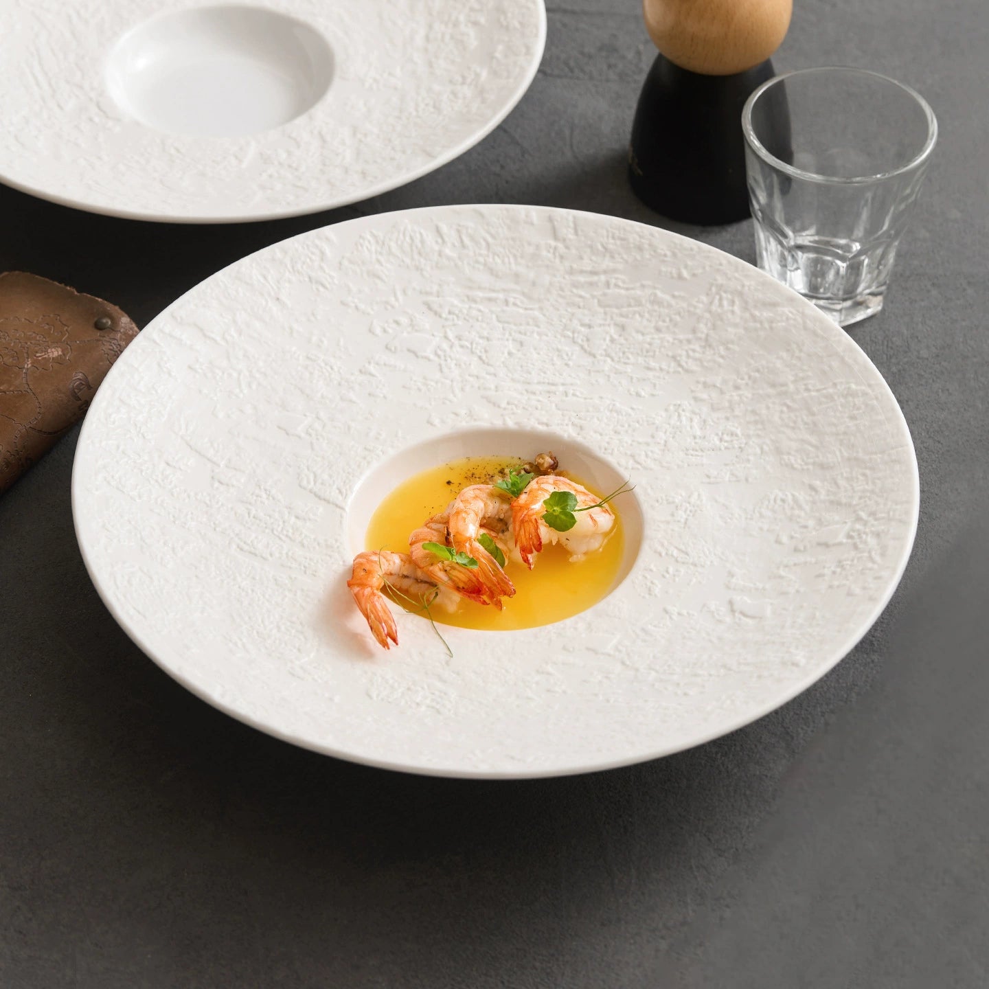 goseung phantom sand ceramic hat plate top down view with cooked shrimp appetizer