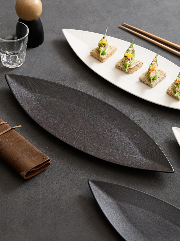 goseung white long boat dish with delicate bite sized appetizers