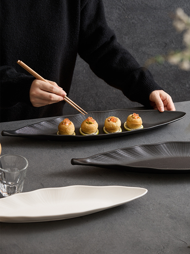 goseung white long leaf dish with delicate bite sized treats