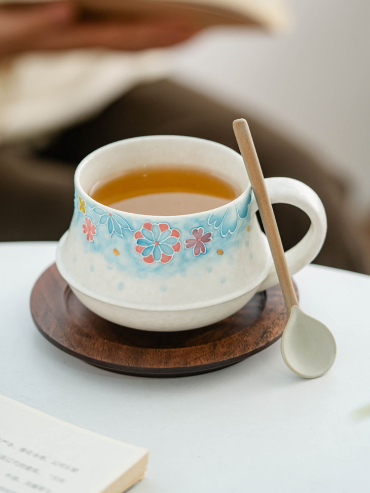 hand crafted porcelain cup with tactile 3D flower relief in blue