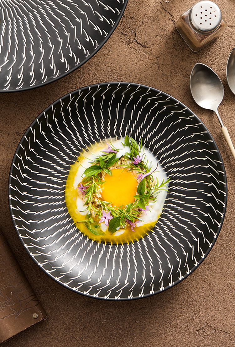 Dish with a decorative pattern on a brown surface