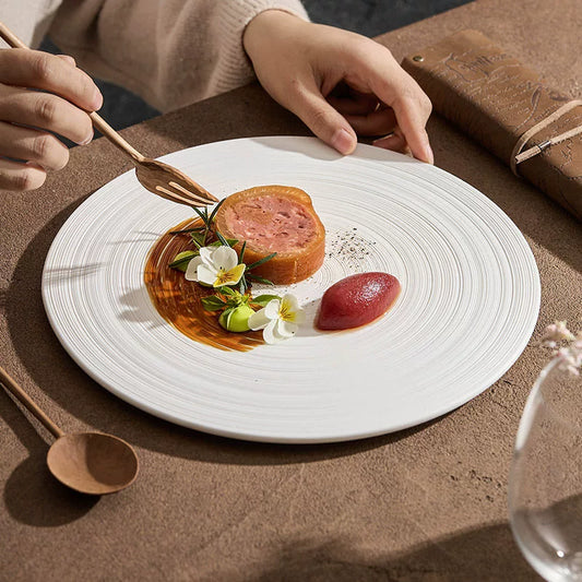 minimalist flat slate plate with concentric silk thread pattern top view