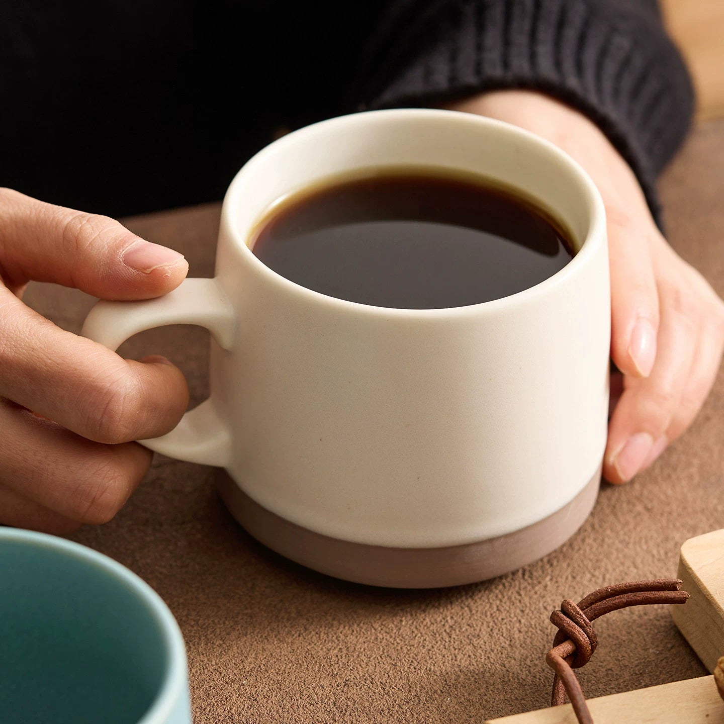 minimalist morandi style coffee mug with raw terracotta base