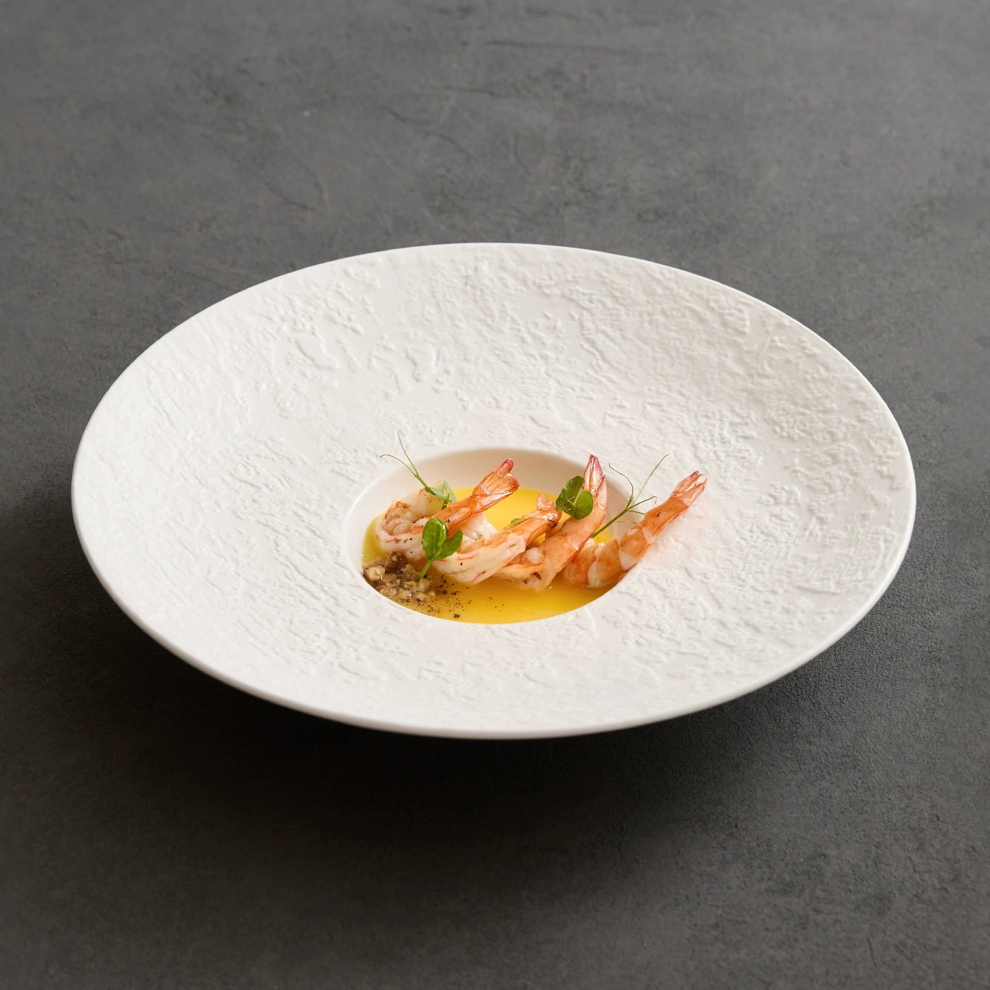 minimalist pure white gourmet sombrero plate with textured stone rim