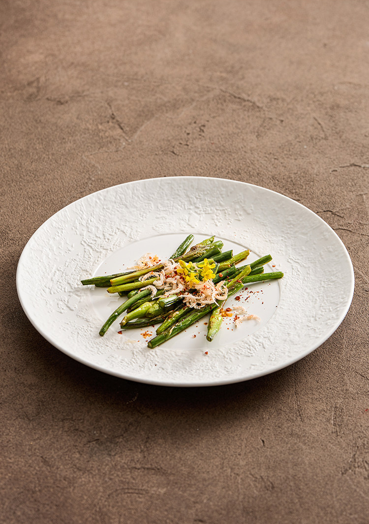 minimalist white ceramic serving platter with sand textured borders
