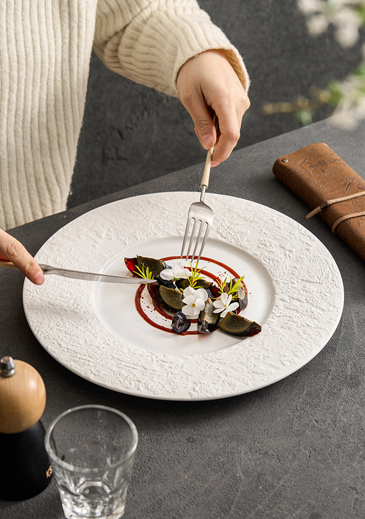 premium tactile ceramic charger plate with organic sand textured margins